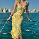 Vestido longo de verão com estampa floral criptográfica e decote profundo, modelo sexy sem costas, estilo fada, perfeito para férias na praia ou como peça de roupa.
